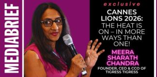 MediaBrief cover showing a woman in a pink top holding a microphone on a purple background beside a Cannes Lions 2026 feature panel on the right.