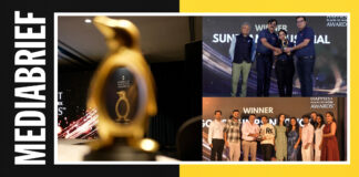 Collage from an award ceremony: a blurred golden trophy in the foreground, groups of people on stage receiving awards, with 'WINNER' text in the background and a team photo below.