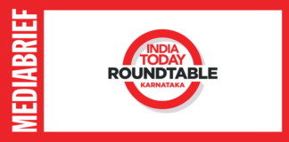 India Today Roundtable Karnataka logo centered in a white panel with a red border; vertical MEDIA BRIEF text on the left edge.